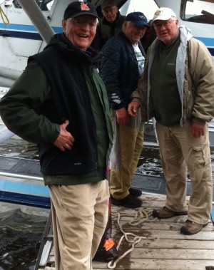 George Millard, Harry Munger, Bruce Meyer, and Walter Mondale boarding a float plane to leave Lake Elsie.